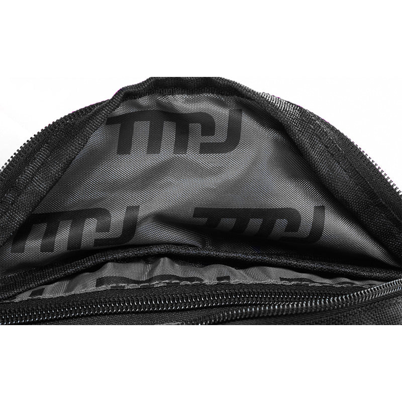 Image of inside of black TMJ Apparel Bumbag with black custom printed TMJ liner.
