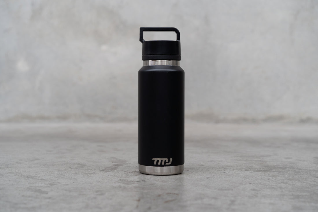 Image of black stainless steel TMJ Apparel 1 litre drink bottle.
