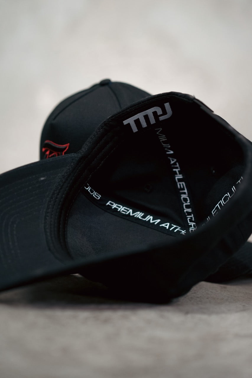 Inside of Black TMJ Apparel 9PHIFTY A-Frame Snapback Hat showing custom TMJ tag and Premium Athleticulture Goods custom sweatband tag.